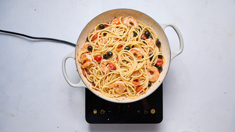 shrimp and pasta in skillet