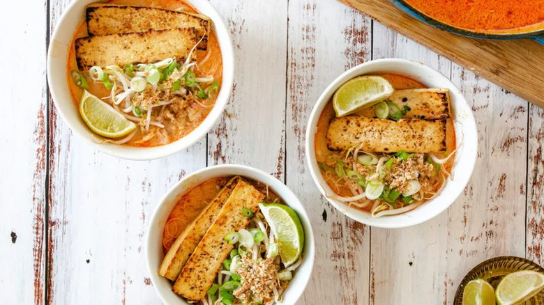 Bowls of laska with lime