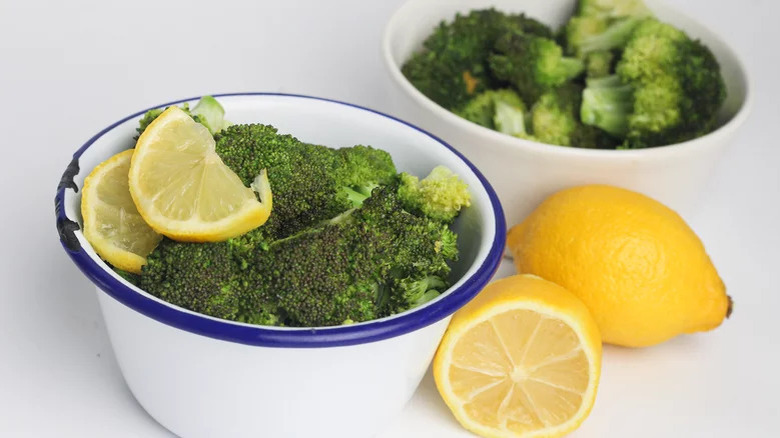 broccoli in bowl with lemons