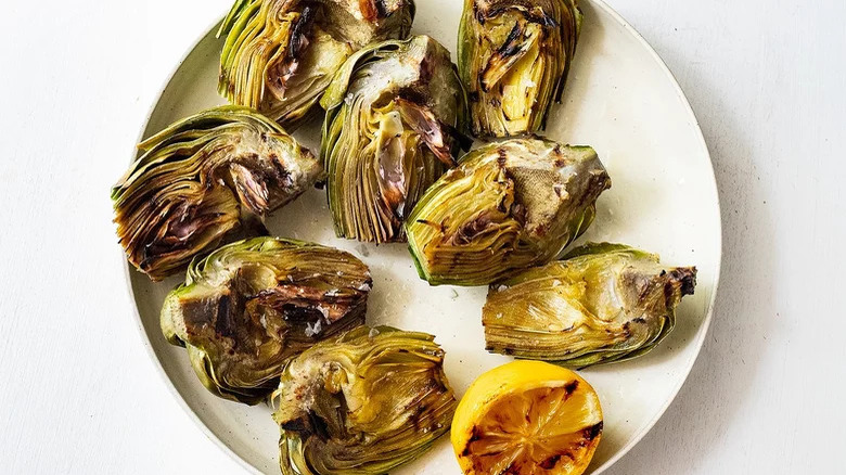 sliced grilled artichokes with lemon