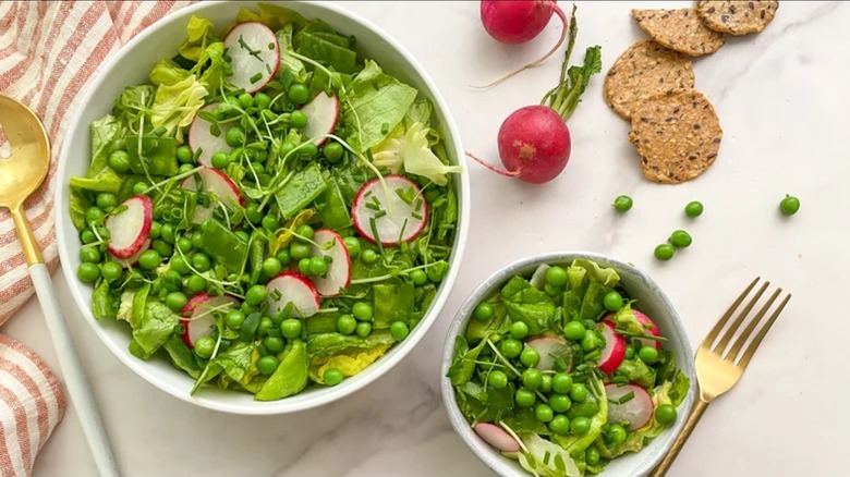 Two bowls of pea salad