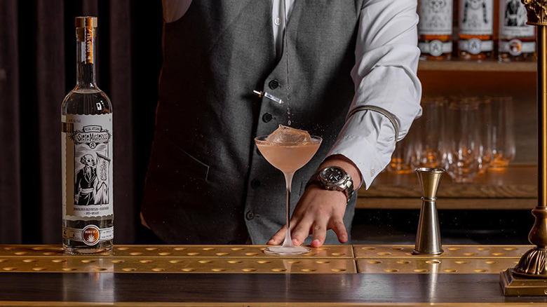 Bartender pouring cocktail with Siete Misterios