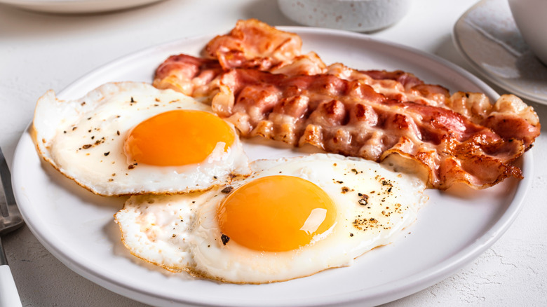 bacon and eggs on plate