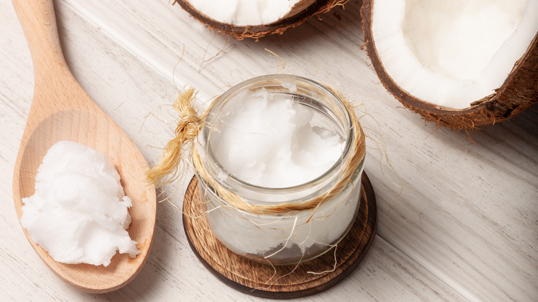 fresh coconuts with coconut oil and spoon