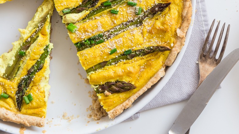 Top-down view of vegan quiche with asparagus