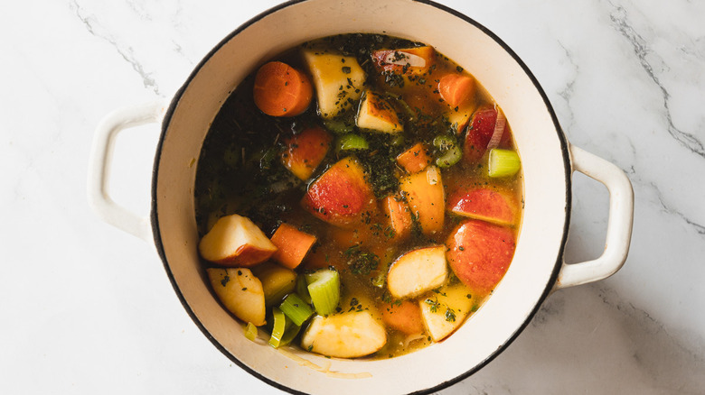 carrot apple soup in pot