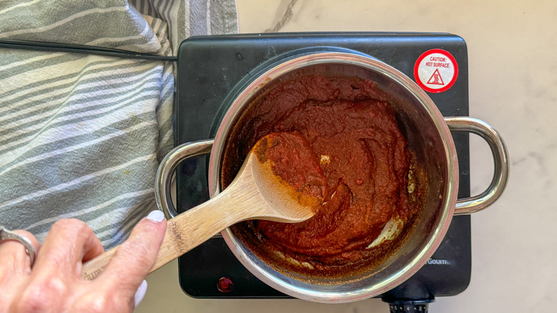 hand stirring the paste