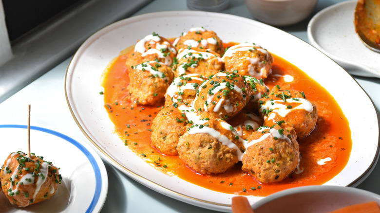 Tray of saucy Buffalo meatballs