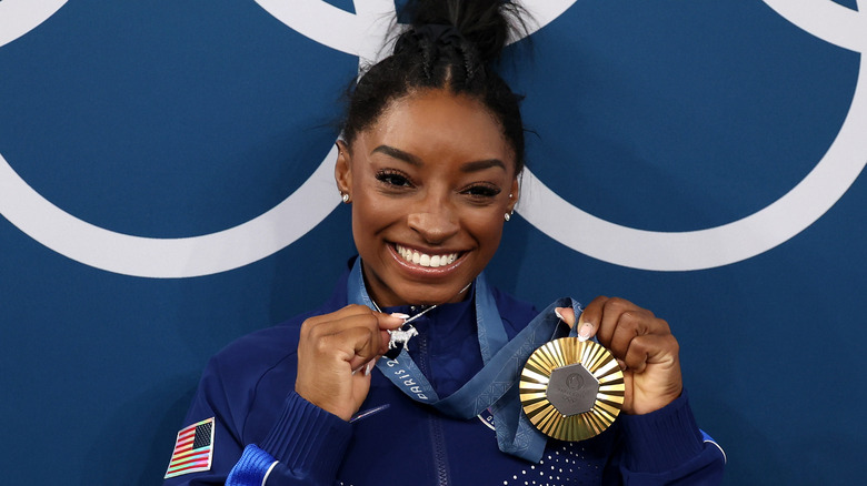 Simone Bile's with gold medal