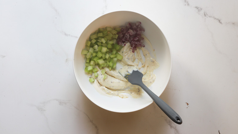 Red onion added to bowl