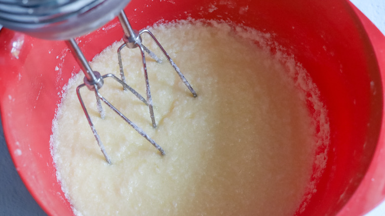 mixing blueberry bread wet ingredients