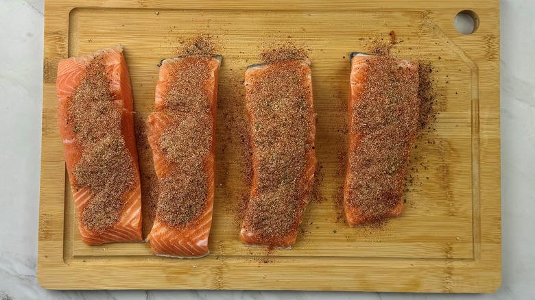 seasoned salmon on wooden board