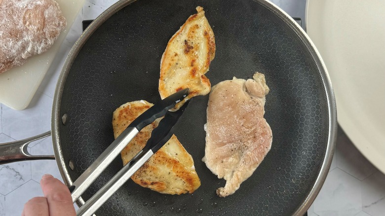 chicken cooking in skillet