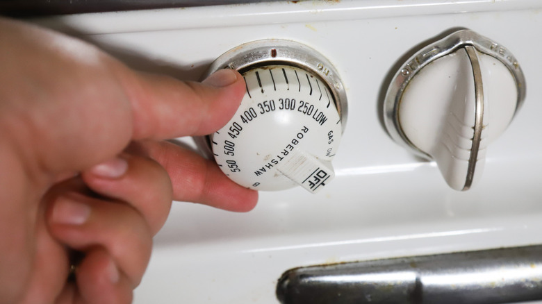 Hand turning oven dial