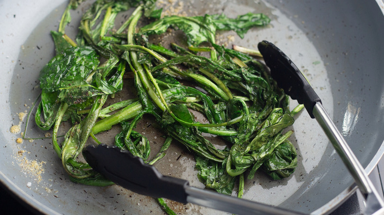 sautéed dandelion greens in pan