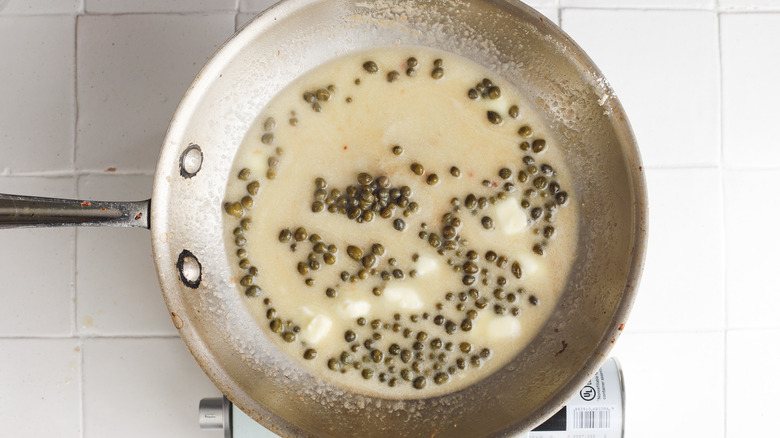 Butter and capers in pan