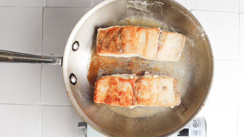 Two browned fish filets