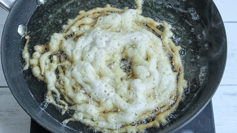 the raw batter starting to fry