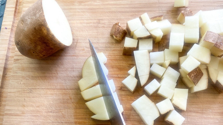 potatoes on cutting board 