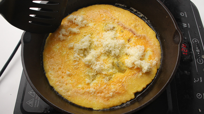 Omelet in pan with cheese