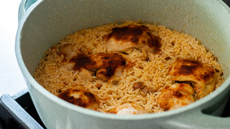 rice and chicken in pot