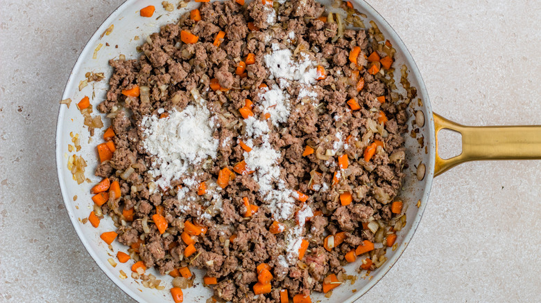 beef and carrots in skillet 