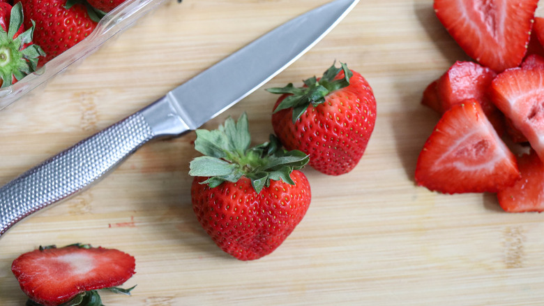 chopped strawberries and knife