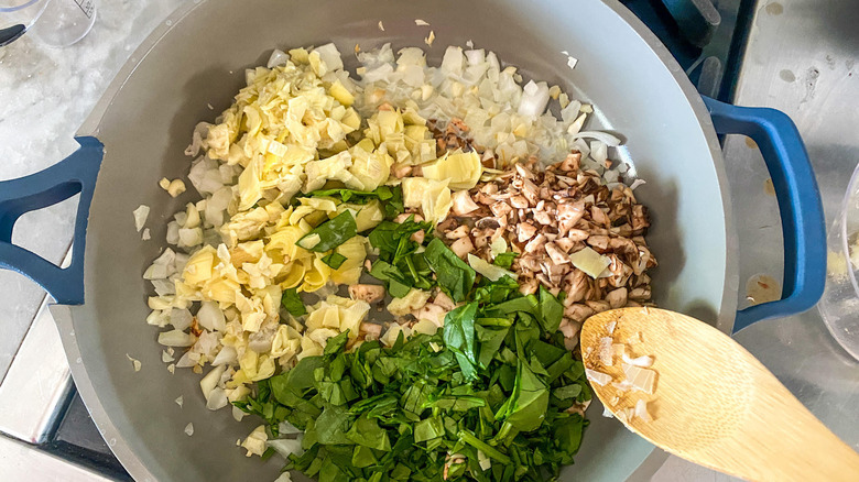 filling ingredients in a pan 