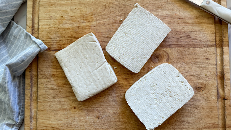 3 slabs of tofu on board