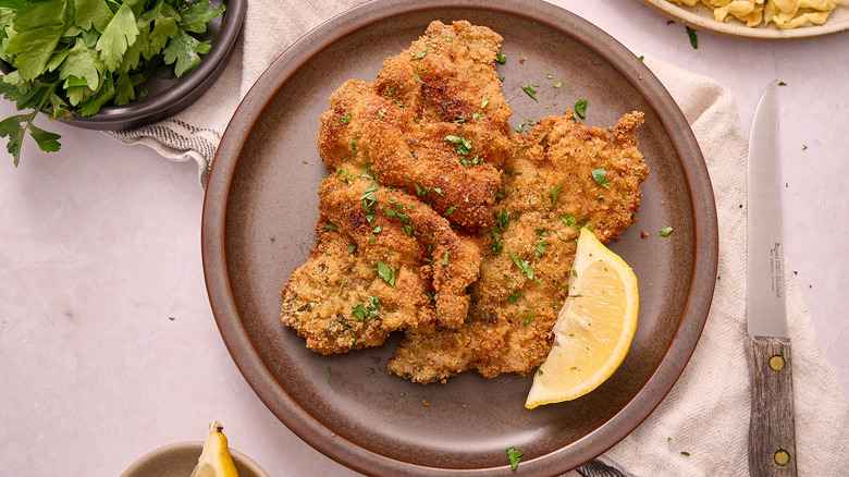 wiener schnitzel on plate with lemon