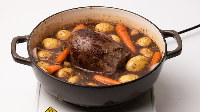 Venison, potatoes, and carrots in pan