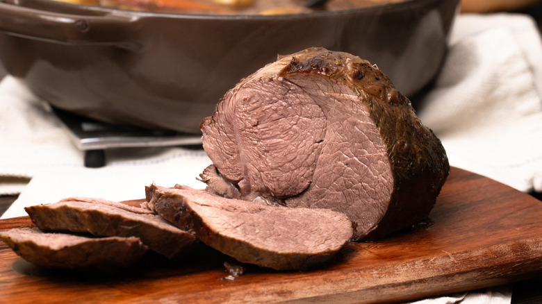 Sliced venison on cutting board