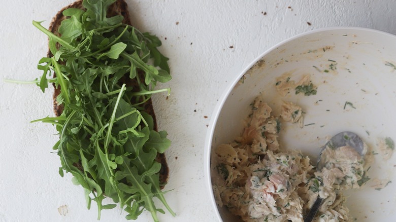 Bread topped with arugula