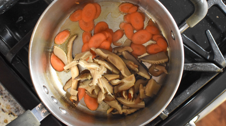 mushrooms and carrots in pot