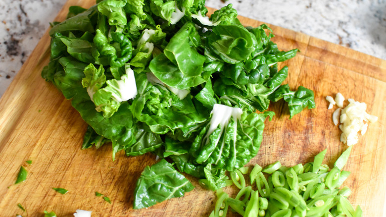 greens on a cutting board 