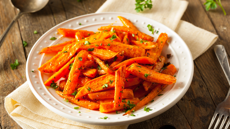Plate of roasted carrots with herbs
