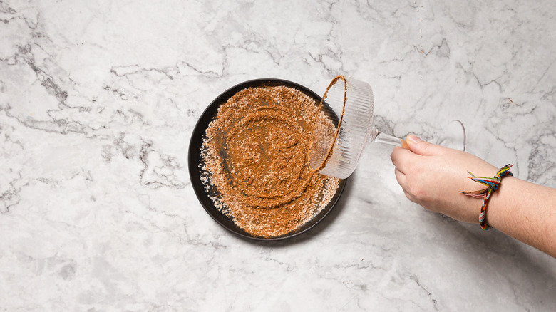 Rimming glass with cinnamon salt mixture