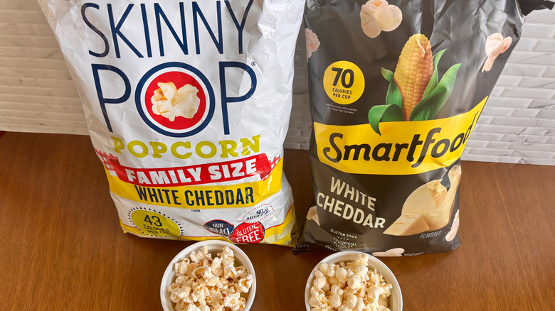 Skinny Pop and Smartfood bags with bowls of popcorn