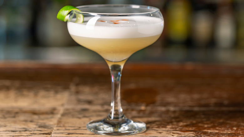 Tequila sour with lime zest