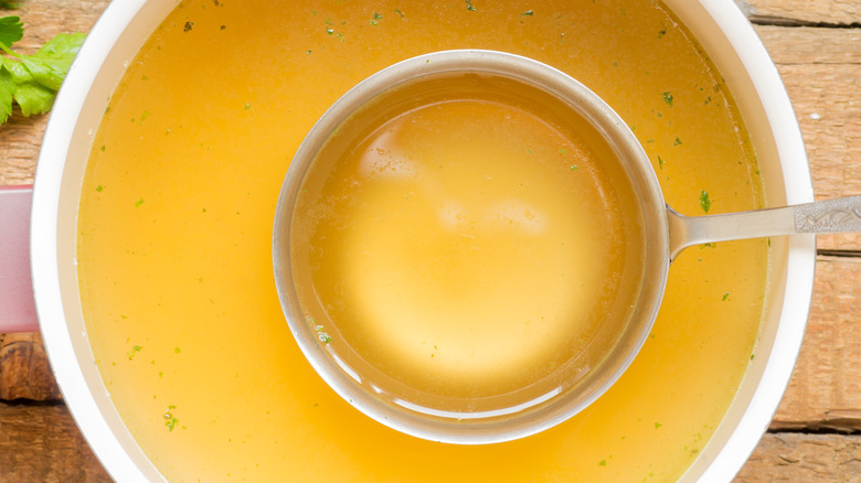 ladle in bowl of broth