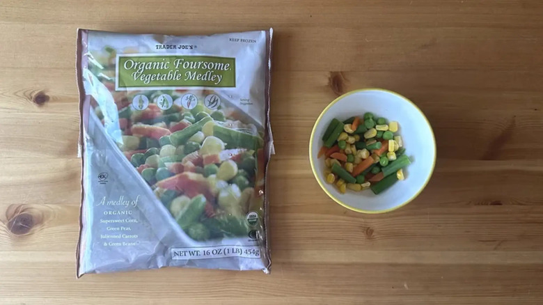 Bag and bowl of  Trader Joe's frozen Organic Foursome Vegetable Medley