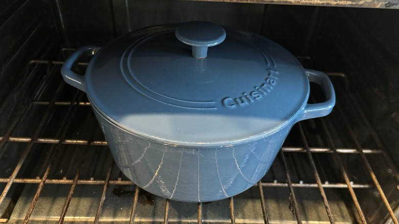 blue lidded pot in oven