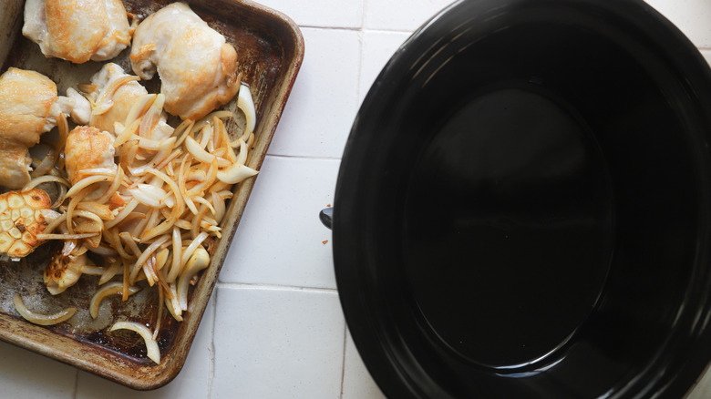 Preparing slow cooker with chicken