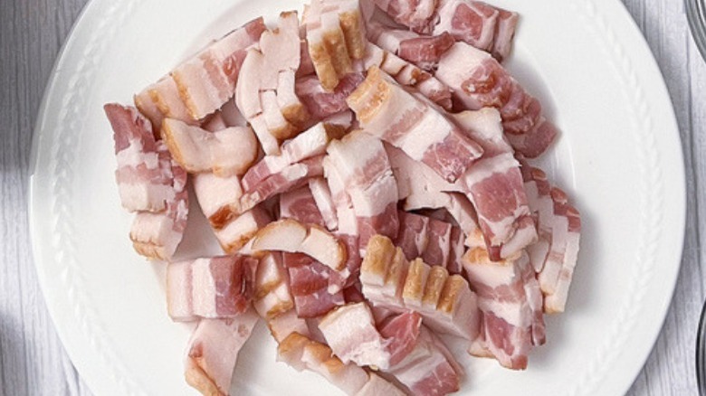 chopped raw bacon on plate