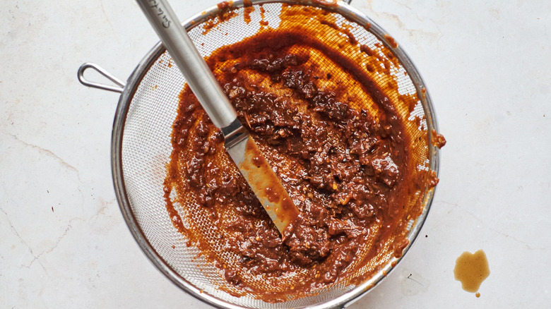 straining the adobo sauce