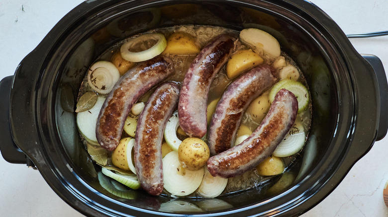 brats and vegetables in slow cooker