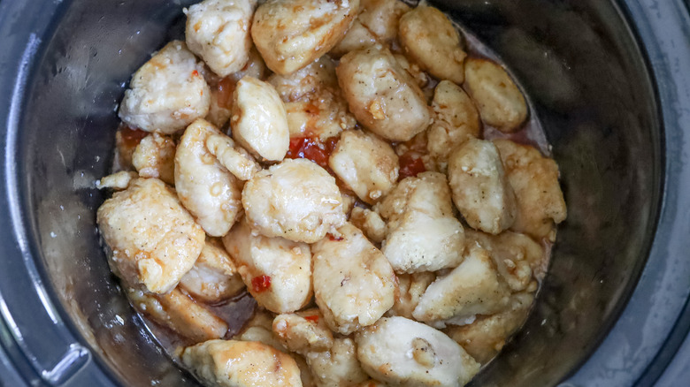 chicken and sauce in crockpot