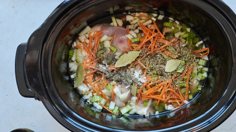 chicken and seasonings in slow cooker