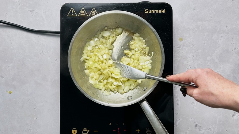 sauteing onions and garlic in skillet