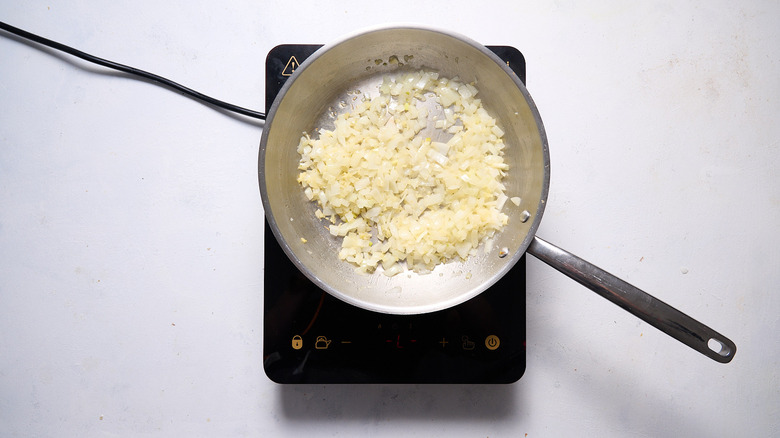 cooking onions in a skillet